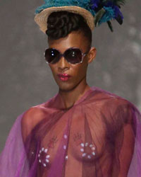 A model presents a creation by Meleese Payne during the second runway show of Guyana Fashion Week at Rahaman's Park in Houston