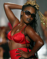 A model presents a creation by Meleese Payne during the second runway show of Guyana Fashion Week at Rahaman's Park in Houston