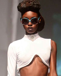 A model presents a creation from Tyrone Nelson during the final runway show of the inaugural Guyana Fashion Week