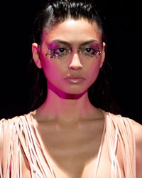 A model presents a creation by designer Serkan Cura as part of his Haute Couture Spring-Summer 2014 fashion show in Paris