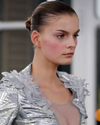 A model presents a creation by French designer Julien Fournie as part of his Haute Couture Spring-Summer 2014 fashion show in Paris