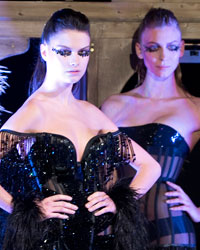 Models present creations by designer Serkan Cura as part of his Haute Couture Spring-Summer 2014 fashion show in Paris