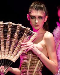 A model presents a creation by designer Serkan Cura as part of his Haute Couture Spring-Summer 2014 fashion show in Paris