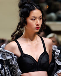 A model presents a creation by French designer Franck Sorbier as part of his Haute Couture Spring-Summer 2014 fashion show in Paris