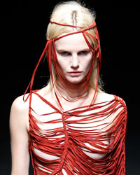 A model presents a creation by Chinese designer Yiqing Yin as part of her Haute Couture Spring-Summer 2014 fashion show in Paris