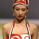 A Chinese model walks down the runway at a swimwear show, highlighting the 2008 Olympic Games, during the China International Fashion Week.