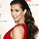 Kim Kardashian arrives for the runway during the Heart Truth`s Red Dress 2010 collection during New York Fashion Week