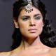 A model wears jewellery during display of creations of Indian fashion designer Rockey S