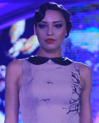 A model walks the ramp displaying an outfit by designer Ken Ferns, at a fashion show held by Kanakia Paris