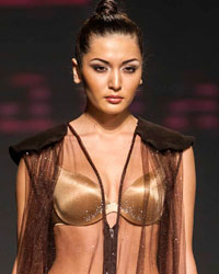 A model presents a creation by Kazakhstan's designer Aya Bapani during Kazakhstan Fashion Week in Almaty