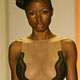 A model poses on the runway wearing a Shay Todd design at Swim Shows Miami at the Raleigh Hotel on Miami Beach.