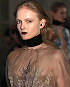 A model presents a creation from the Fyodor Golan Autumn-Winter 2013 collection during London Fashion Week