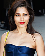 Actress Freida Pinto arrives for the Burberry Prorsum Womenswear Autumn-Winter 2013 Show in Hyde Park during London Fashion Week