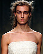 Models present creations from the Simone Rocha Autumn-Winter 2013 collection during London Fashion Week