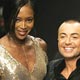 Designer Julien MacDonald waves with Naomi Campbell after his autumn/winter 2005/2006 collection during London Fashion Week.