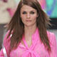 Danish supermodel Helena Christensen wears an outfit by British designer Matthew Williamson during London Fashion Week.