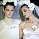 Models display bridal dresses by Spanish designer Francis Montesinos as part of his fall-winter 2005/06 collection at the Pasarela Cibeles fashion show in Madrid.