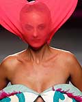 A model presents a creation from designer Agatha Ruiz de la Prada during the Spring/Summer 2013 Fashion Week in Madrid