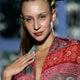 A model displays a creation by South Korean designer Kukso Koo during his debut women's spring/summer 2006 fashion week show in Milan.