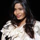 Freida Pinto poses for the photographers before Dolce & Gabbana Fall/Winter 2009/10 women`s collection during Milan Fashion Week