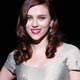 Scarlett Johansson poses for the photographers before Dolce & Gabbana Fall/Winter 2009/10 women's collection during Milan Fashion Week