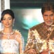 Amitabh Bachchan showcases a new creation with his daughter Shweta and actor son Abhishek, by Indian designers Abu Jani and Sandip Khosla during a fashion show in Mumbai.