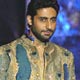 Bollywood star Abhishek Bachchan showcases a new creation with models, by Indian designers Abu Jani and Sandip Khosla during a fashion show in Mumbai.