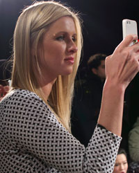 Nicky Hilton takes a photo during the Charlotte Ronson 2014 Fall/Winter collection presentation during New York Fashion Week