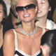 Paris Hilton gets settled into her seat before the Diane von Furstenberg show at Fashion Week in New York.