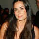 Demi Moore smiles before watching the Donna Karan Spring 2008 collection show during New York Fashion Week