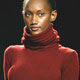 A model wears a cranberry merino turtleneck sweater during the Kenneth Cole show at Fashion Week show in New York.