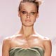 Inguna models an olive green silk gazar strapless pleated gown by Monique Lhuillier at New York's Fashion Week.