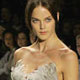 A model wears a gray gazaar dress with organza petals by J. Mendel at New York's Fashion Week.