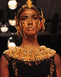 A model displays the creation by fashion designers from Outhouse Akaaro