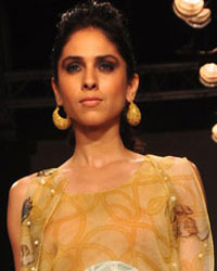 A model displays the creation of Pakistani fashion designer Sania Maskatiya