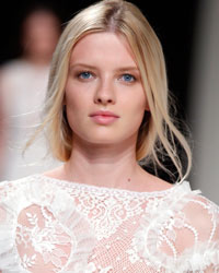 A model presents a creation by British designer Peter Copping as part of his Spring-Summer 2014 women's ready-to-wear fashion show for house Nina Ricci during Paris fashion week