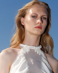 A model presents a creation by French designer Christine Phung as part of her Spring-Summer 2014 women's ready-to-wear fashion show during Paris fashion week