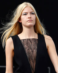 A model presents a creation by French designer Maxime Simoens from his Spring/Summer 2014 women's ready-to-wear collection during Paris Fashion Week