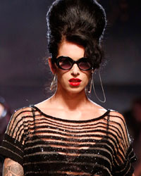 A model presents a creation by French designer Jean Paul Gaultier as part of his Spring/Summer 2014 women's ready-to-wear fashion show during Paris fashion week