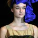 A model presents a creation by Oksana Tandit during Riga Fashion Week