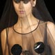 A model presents a creation by KatyaKatya Shehurina during Riga Fashion Week