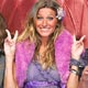 Brazilian super model Gisele Bundchen, along with other models, gestures to photographers after displaying creations as part of Cocci's 2005 Autumn/Winter collection at Rio Fashion week.