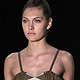 Models present creations from Huis Clos' Summer 2012 collection during Sao Paulo Fashion week in Sao Paulo