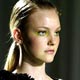 A model displays a creation for Brazilian designer Reinaldo Lourenco as part of his 2005 Spring/Summer collection show, at Sao Paulo Fashion Week.