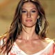 Brazilian model Gisele Bundchen displays a creation from the Colcci Spring/Summer collection during Sao Paulo Fashion Week