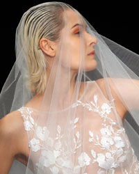 A model presents a creation by We Couture during the 2014 Spring-Summer Shanghai Fashion Week.