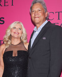 CEO and President of Victoria's Secret Sharen Turney (L) and husband Charles Turney arrive before the Victoria's Secret Fashion Show taping in New York