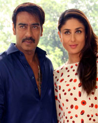 Ajay Devgn and Kareena Kapoor at a photo shoot for promoting Singham Returns