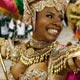 A Carnival reveller from the Mangueira samba school parades during the first of two nights of competition between the premier league of schools in Rio de Janeiro