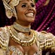 A Carnival reveller from the Mangueira samba school parades during the first of two nights of competition between the premier league of schools in Rio de Janeiro